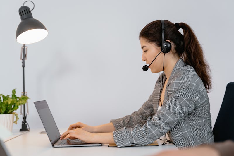 Virtual healthcare administrative professional managing scheduling and patient communications from a remote office environment